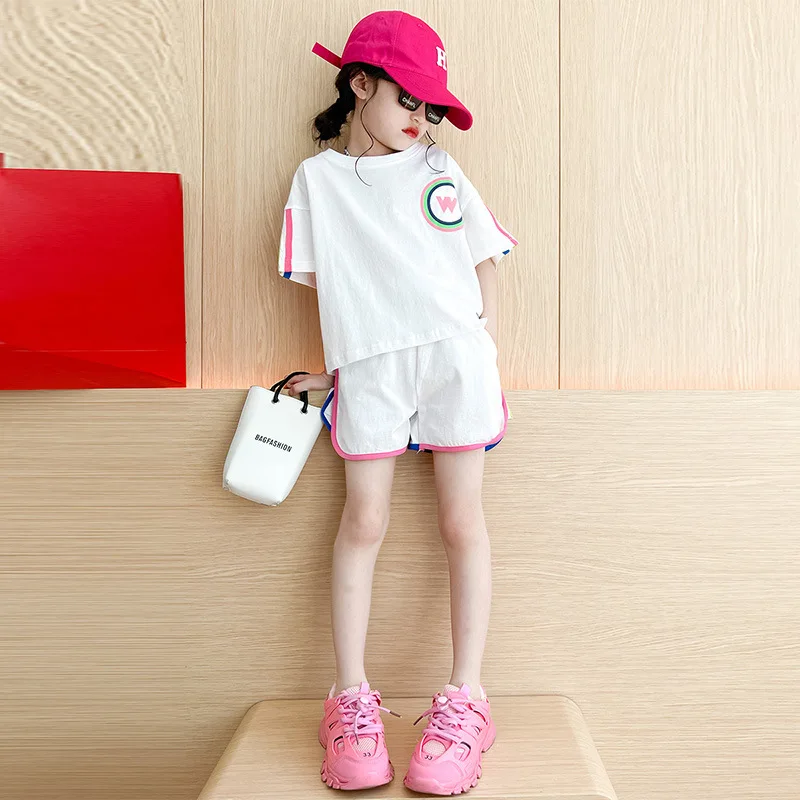 Корейска детска летни дрехи 2023 г., къс ръкав за момичета по-малки деца + ежедневни панталони, комплект от 2 теми, дрехи за почивка за тийнейджъри, спортен костюм Изображение 2
